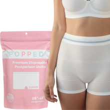 Load image into Gallery viewer, A package of Popped brand disposable postpartum underwear with a visual of the underwear on a model wearing a white bra.
